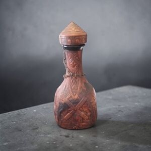 Jeype vintage Spanish glass decanter wrapped in embossed, tooled leather. 